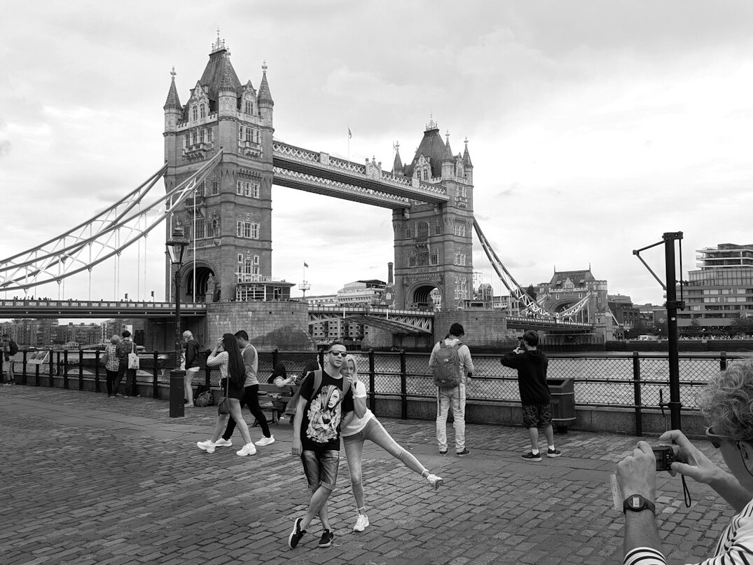 person taking photo in city