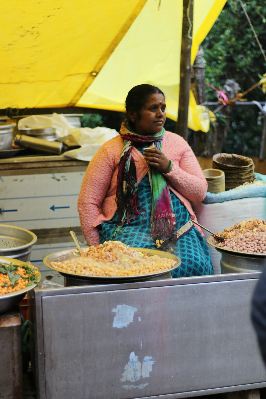 woman selling food on street